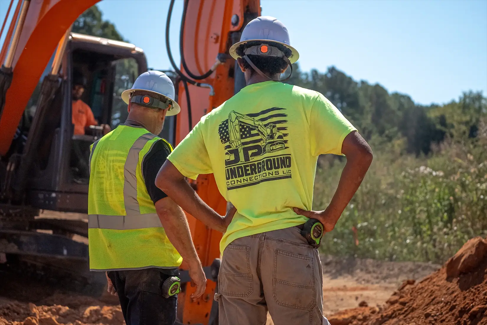 Construction worker in a yellow shirt.